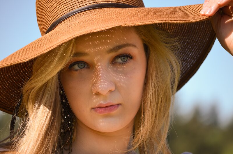 woman in straw hat outdoors