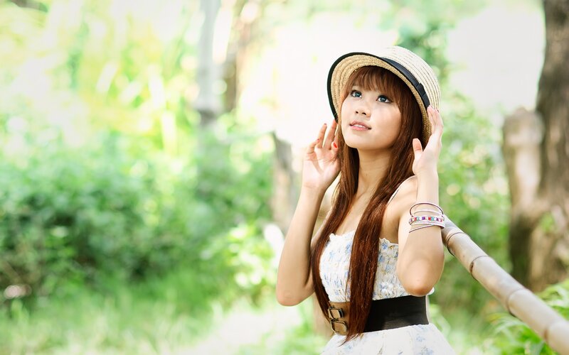 woman in straw hat outdoors