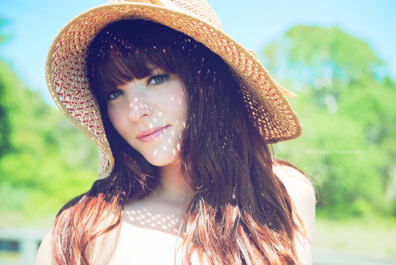 woman in straw hat outdoors