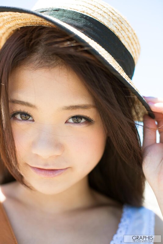 woman in straw hat smiling
