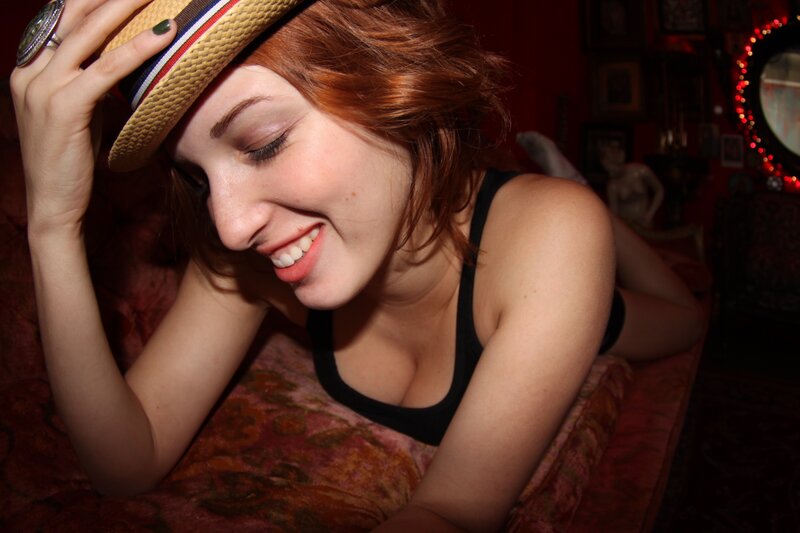 woman in straw hat smiling