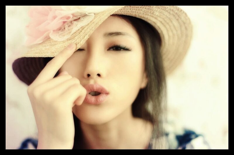 woman in straw hat with flower