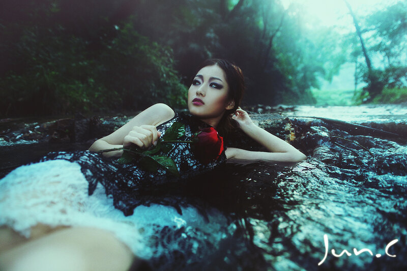 Woman in Stream with Rose