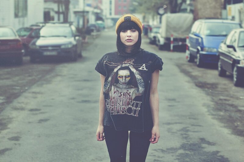 woman in street wearing band t-shirt