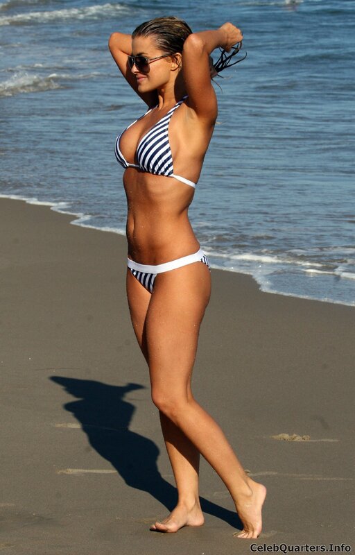 Woman in striped bikini on beach