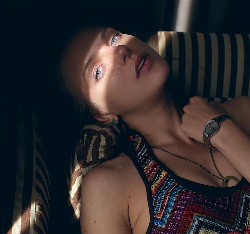 woman in striped chair
