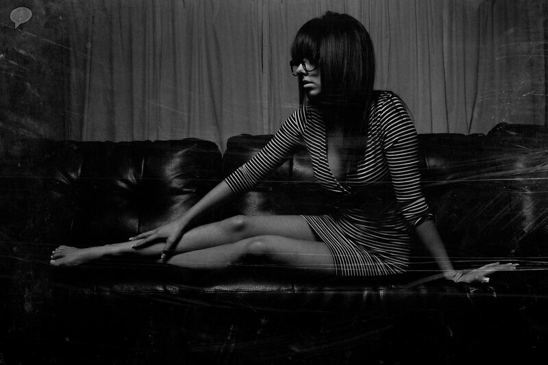 Woman in Striped Dress — Black, Dramatic, Photograph, Sofa