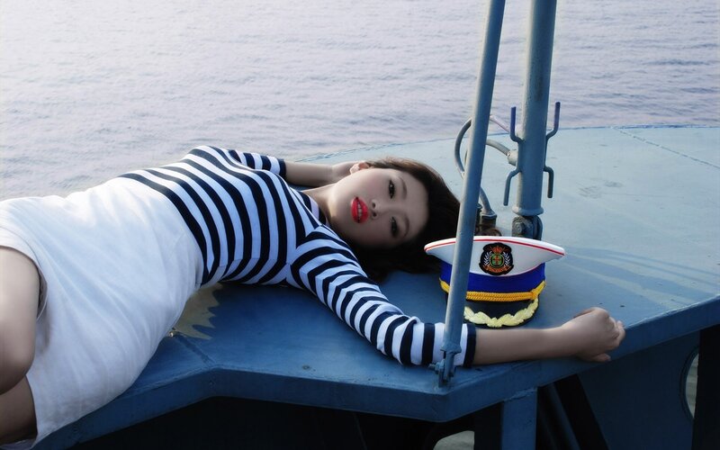 Woman in striped dress on boat