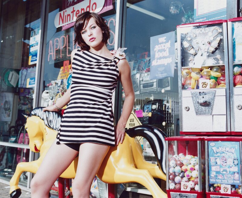 Woman in striped dress on carousel horse