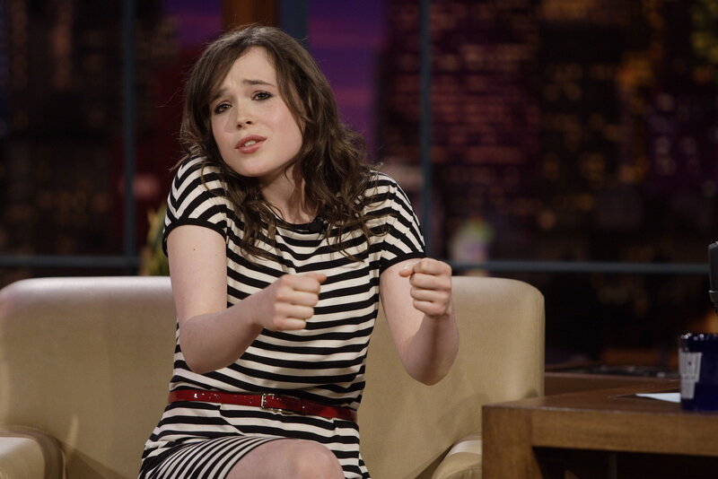woman in striped dress on talk show