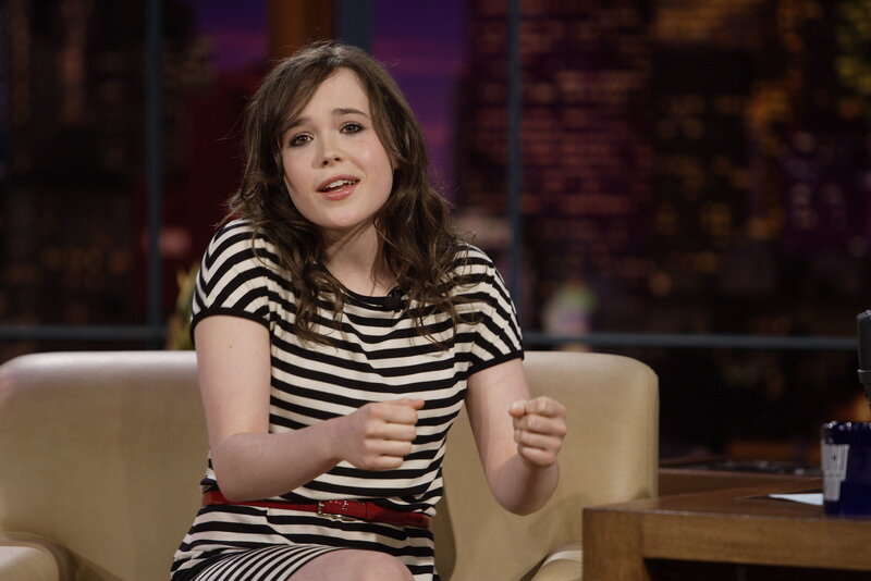 woman in striped dress on talk show