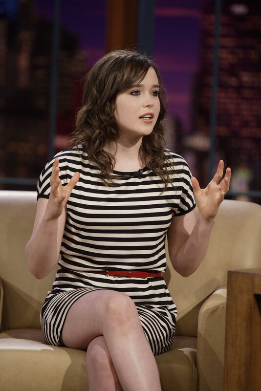 woman in striped dress on talk show