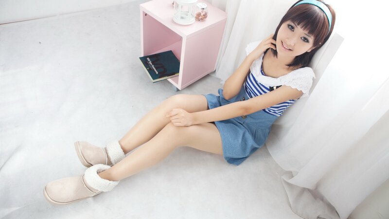 woman in striped dress sitting on floor