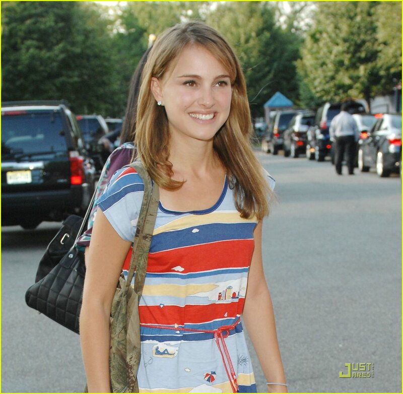 woman in striped dress smiling