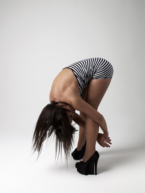 woman in striped outfit bending over