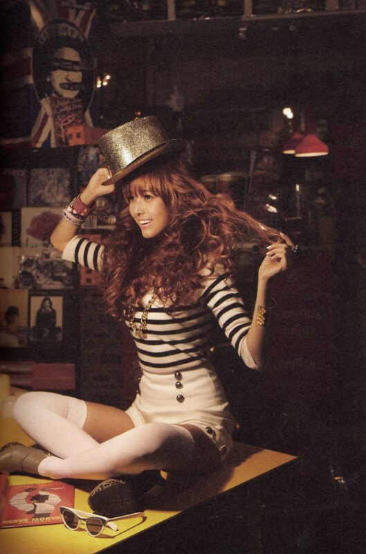 woman in striped outfit with hat