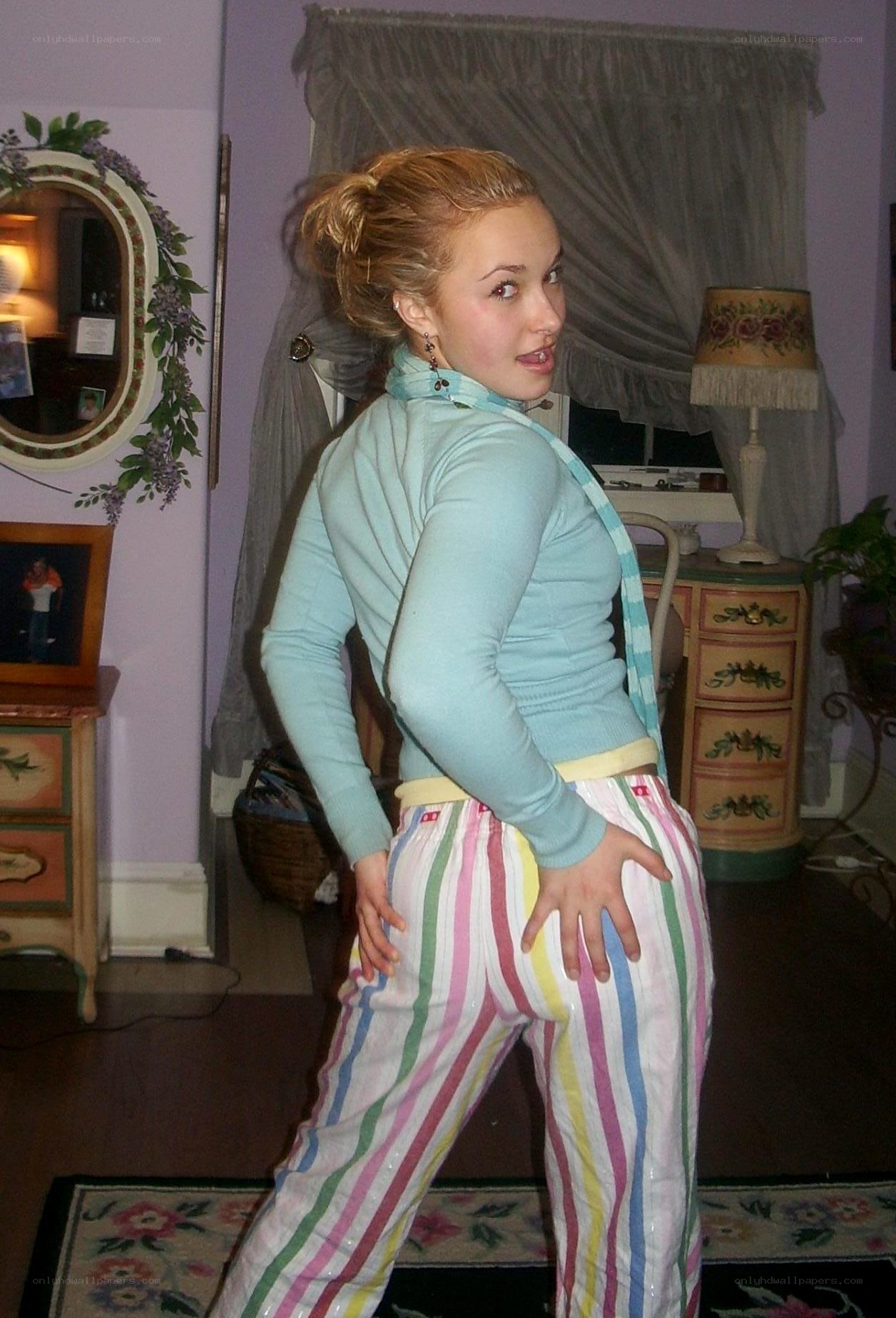 woman in striped pants posing