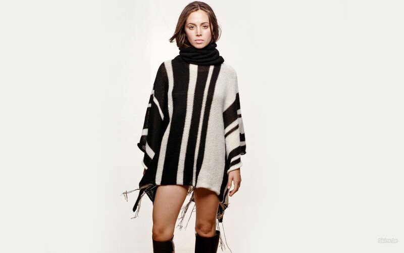 woman in striped poncho