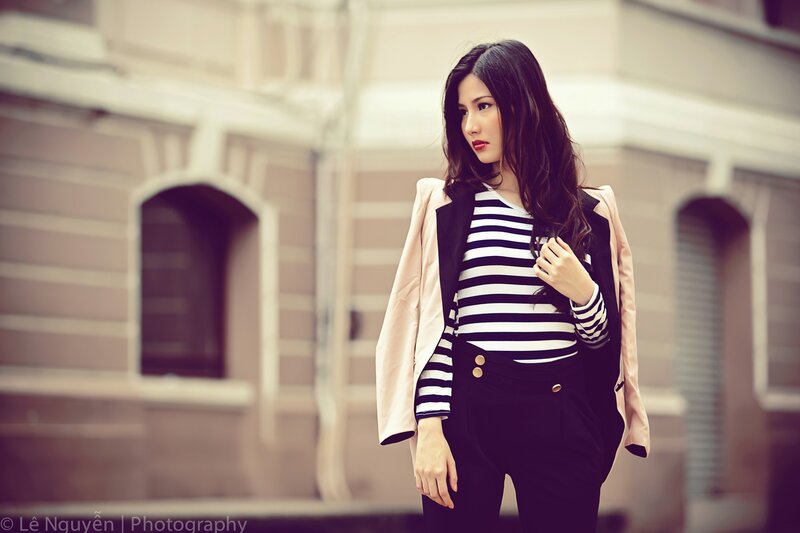 woman in striped shirt and blazer