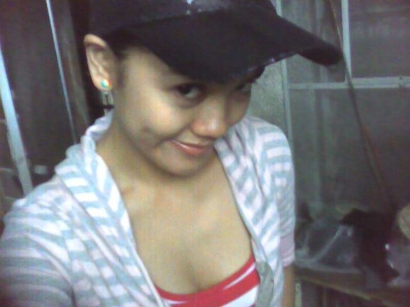 woman in striped shirt and cap