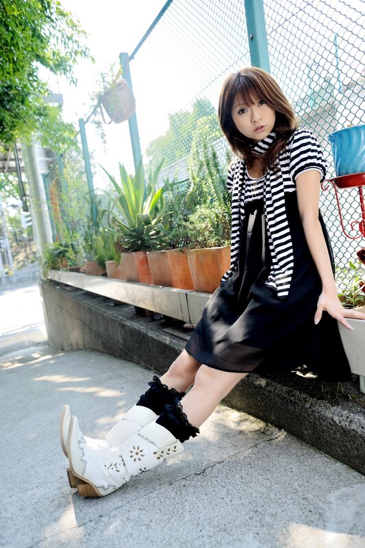 Woman in Striped Shirt — Black, Relaxed, Afternoon, Photograph