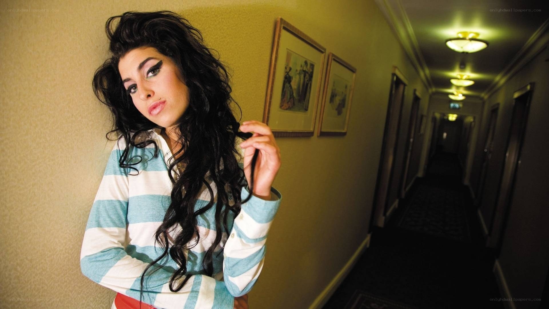 woman in striped shirt in hallway