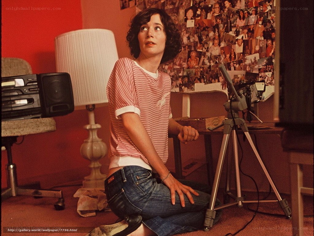 woman in striped shirt kneeling