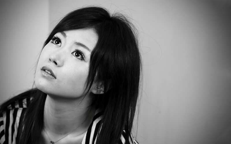 woman in striped shirt looking up