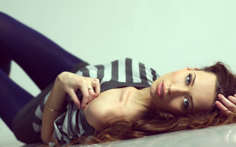 woman in striped shirt lying down