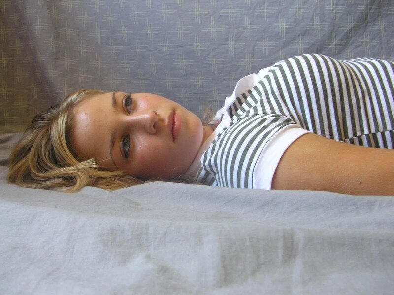 woman in striped shirt lying down