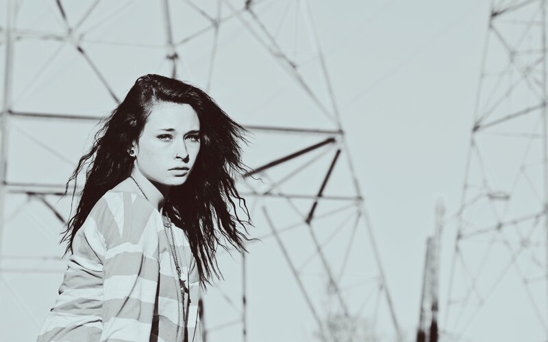 woman in striped shirt near power lines