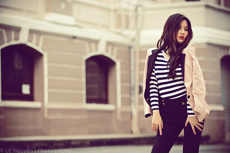 woman in striped shirt on street