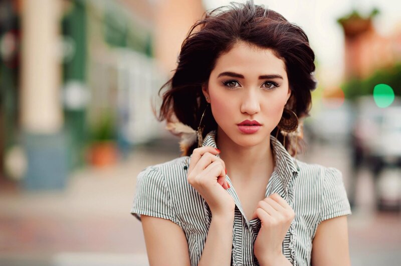 woman in striped shirt on street