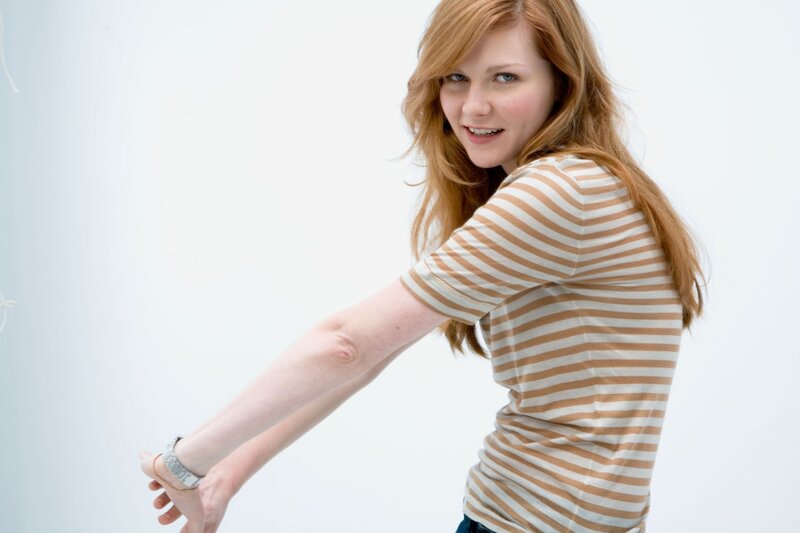 woman in striped shirt stretching