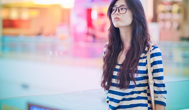 woman in striped shirt waiting