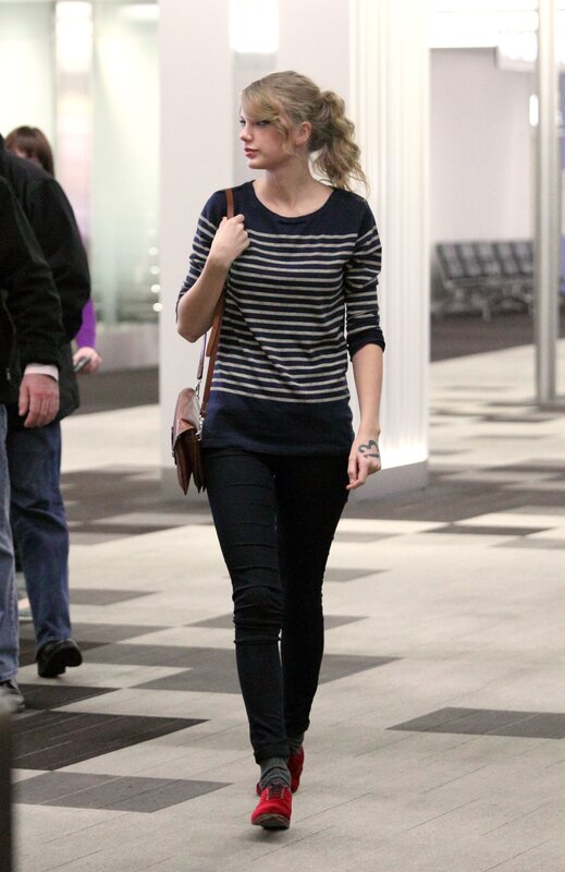 woman in striped shirt walking