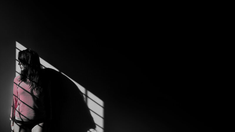 woman in striped shirt with shadows
