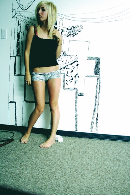 woman in striped shorts standing