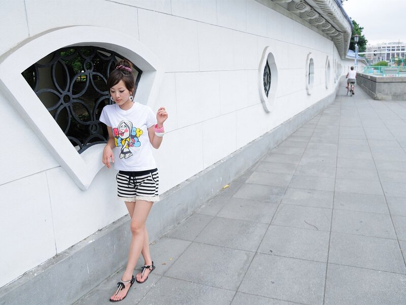 Woman in striped shorts walking