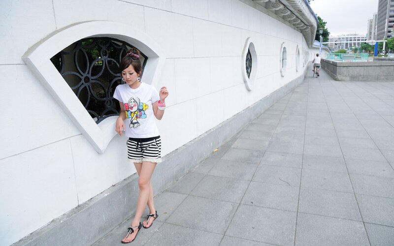 Woman in striped shorts walking