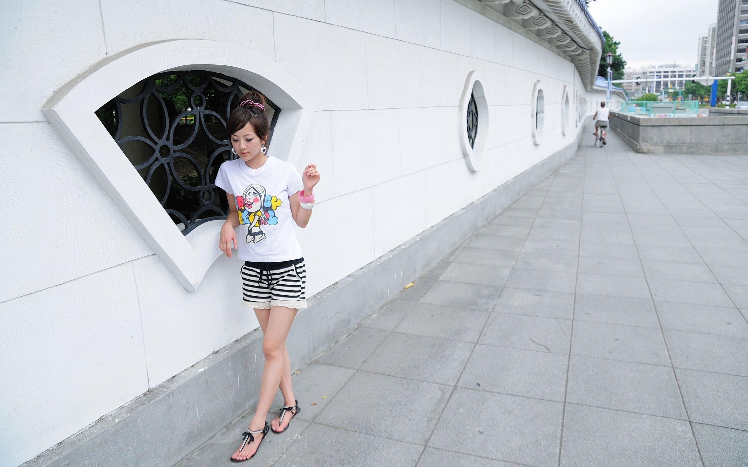 Woman in striped shorts walking