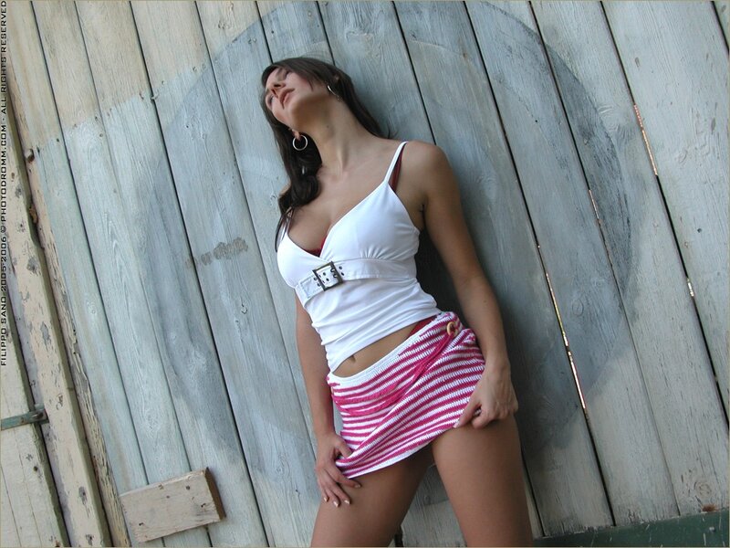 Woman in striped skirt leaning
