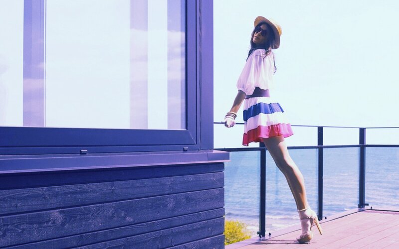 Woman in striped skirt on deck