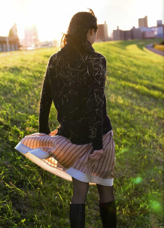 woman in striped skirt on grass