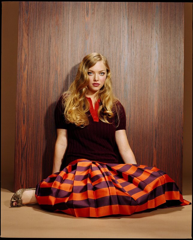 woman in striped skirt sitting