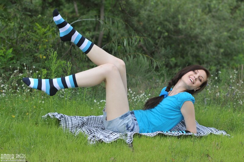 Woman in striped socks on grass