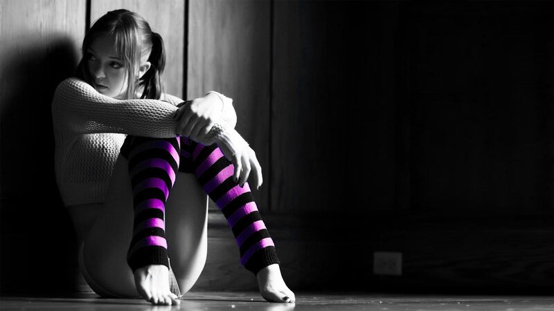 woman in striped socks sitting