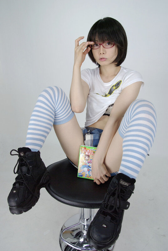woman in striped socks sitting on stool