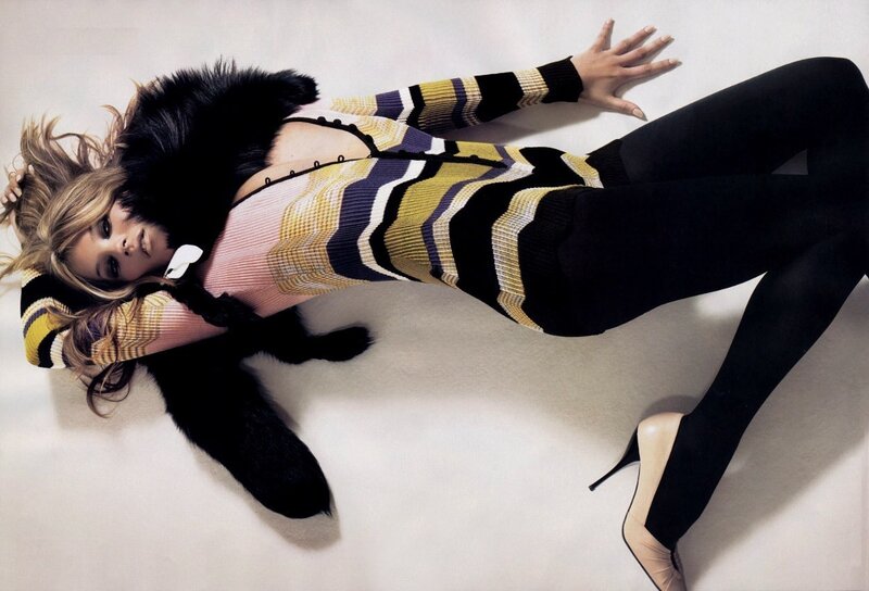 woman in striped sweater lying down