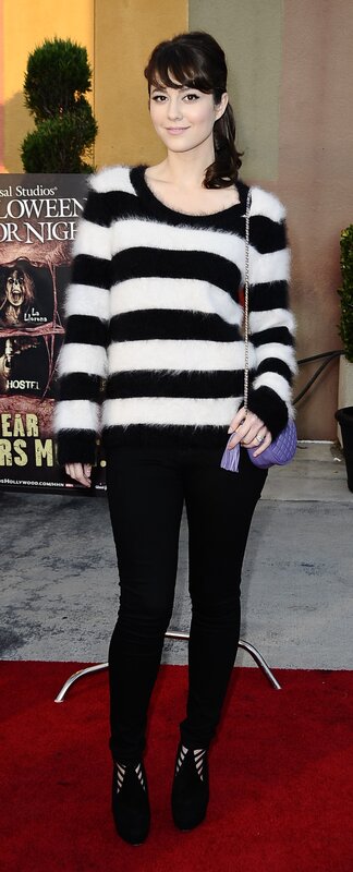 woman in striped sweater on red carpet